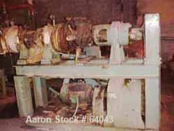 USED:Hot feed extruder. 7" screw diameter, approx 48" long barrel,barrel is jacketed for heating and barrel also has copper spiralwrapped cooling, chain driven thru Falk 40.02:1 gearbox directconnect...