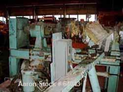 USED:Hot feed extruder. 7" screw diameter, approx 48" long barrel,barrel is jacketed for heating and barrel also has copper spiralwrapped cooling, chain driven thru Falk 40.02:1 gearbox directconnect...