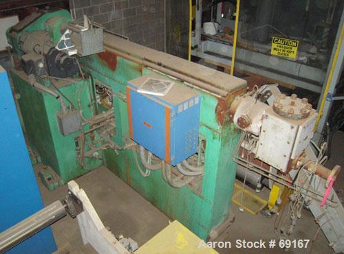 Used Gloucester 3-1/2" Single Screw Extruder, Model 233-001. Approximately 30 to 1 L/D ratio. Electrically heated, water cooled barrel. Driven by a 100 hp DC motor thru a gearbox, ratio 15.398 to 1. ...