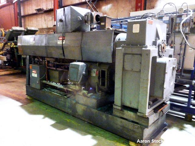 Used Graham 4.5" Single Screw Extruder. 24 to 1 L/D. 6 Zone non-vented. Has electrically heated, water cooled barrel. Extruder equipped with 200 hp DC motor with SCR control and 42" centerline height...