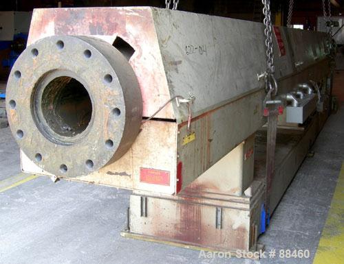 Used Hartig 10" Single Screw Extruder. Approximately 33:1 L/D ratio. Electrically heated, water cooled non-vented barrel. Feed throat, no hopper. Unit includes a Wilson model D4545 gearbox, rated at ...