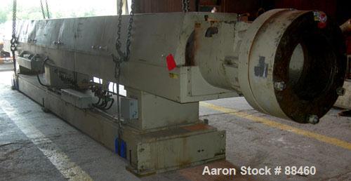 Used Hartig 10" Single Screw Extruder. Approximately 33:1 L/D ratio. Electrically heated, water cooled non-vented barrel. Feed throat, no hopper. Unit includes a Wilson model D4545 gearbox, rated at ...