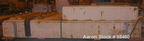 Used Hartig 10" Single Screw Extruder. Approximately 33:1 L/D ratio. Electrically heated, water cooled non-vented barrel. Feed throat, no hopper. Unit includes a Wilson model D4545 gearbox, rated at ...