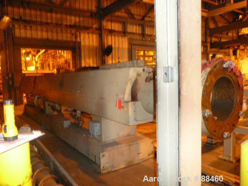 Used Hartig 10" Single Screw Extruder. Approximately 33:1 L/D ratio. Electrically heated, water cooled non-vented barrel. Feed throat, no hopper. Unit includes a Wilson model D4545 gearbox, rated at ...
