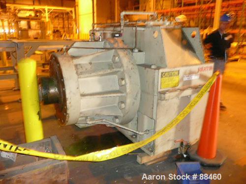 Used Hartig 10" Single Screw Extruder. Approximately 33:1 L/D ratio. Electrically heated, water cooled non-vented barrel. Feed throat, no hopper. Unit includes a Wilson model D4545 gearbox, rated at ...