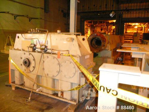 Used Hartig 10" Single Screw Extruder. Approximately 33:1 L/D ratio. Electrically heated, water cooled non-vented barrel. Feed throat, no hopper. Unit includes a Wilson model D4545 gearbox, rated at ...