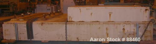 Used Hartig 10" Single Screw Extruder. Approximately 33:1 L/D ratio. Electrically heated, water cooled non-vented barrel. Feed throat, no hopper. Unit includes a Wilson model D4545 gearbox, rated at ...