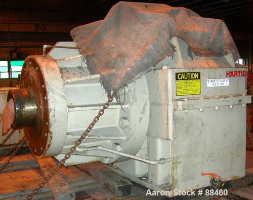 Used Hartig 10" Single Screw Extruder. Approximately 33:1 L/D ratio. Electrically heated, water cooled non-vented barrel. Feed throat, no hopper. Unit includes a Wilson model D4545 gearbox, rated at ...