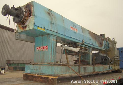 Used Hartig 6" Single Screw Extruder. Model 60/100M24, 24:1 L/D Ratio.  7 zone barrel, electrically heated, water cooled with a 1 1/2 hp pump and heat exchanger, no tank. Water cooled feed with hoppe...