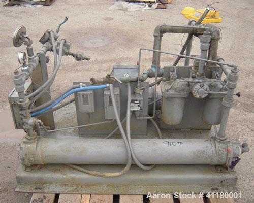 Used Hartig 6" Single Screw Extruder. Model 60/100M24, 24:1 L/D Ratio.  7 zone barrel, electrically heated, water cooled with a 1 1/2 hp pump and heat exchanger, no tank. Water cooled feed with hoppe...