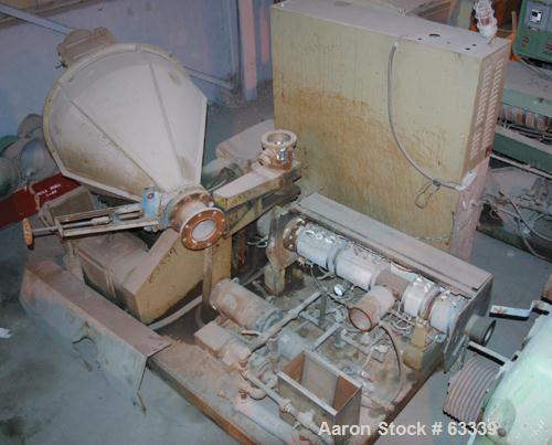 USED: Johnson 2-1/2" Lowboy single screw extruder. 24:1 L/D ratio, electrically heated, water cooled with pump, heat exchanger and holding tank, 4 zone side vented barrel. Water cooled feed with a 1 ...