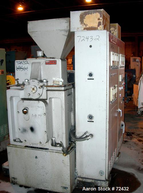 Used Johnson 2.5" Single Screw Extruder, approximately 24:1 L/D ratio. Electrically heated, water cooled, with a closed loop system with tank, heat exchanger and pump. 4 zone side vented (plugged) ba...