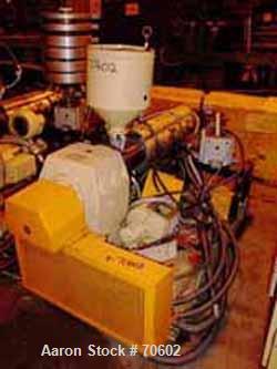 USED: Kuhne type K45-24D 48mm (1.88") single screw extruder, approx 24:1 L/D ratio. Electrically heated, air cooled. Water cooled feedthroat with hopper. Requires an approx 34 kw (45 hp) DC motor.Inc...
