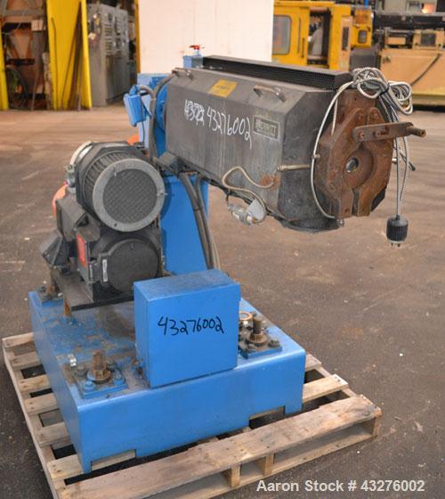 Used Merritt Davis 1-1/2” Single Screw, Model A/C MX. Approximate 24 to 1 L/D ratio. Electrically heated, air cooled 4 zone non-vented barrel, approximate 42" centerline height. Water cooled feed thr...