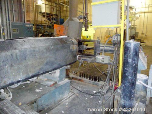Used Merritt Davis 8" Hot Feed Extruder, approximate 12 to 1 L/D ratio. Electrically heated, water cooled. Vented/plugged barrel, 103’’ long. Oversize feed throat, 34’’ x 29’’ with a ram assist. Extr...