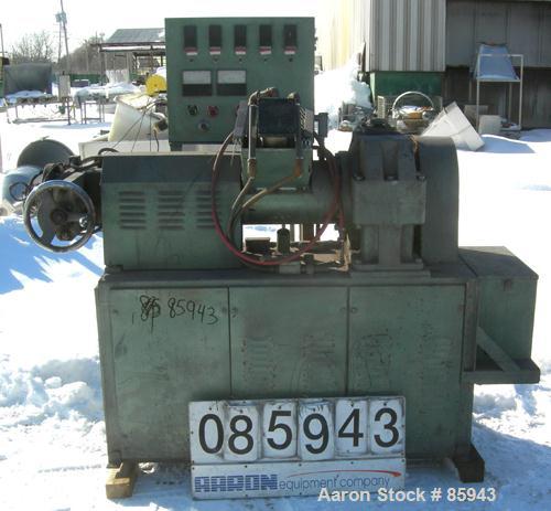 Used Munchy 4" Tapered to 2" Single Screw Extruder, Approximate 8:1 L/D Ratio. Electrically heated, air cooled, non-vented barrel. Feed throat with ram feeder driven by an 11 KW (15 HP) motor thru a ...