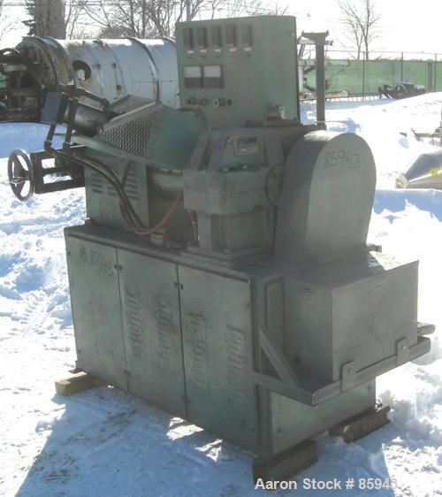 Used Munchy 4" Tapered to 2" Single Screw Extruder, Approximate 8:1 L/D Ratio. Electrically heated, air cooled, non-vented barrel. Feed throat with ram feeder driven by an 11 KW (15 HP) motor thru a ...