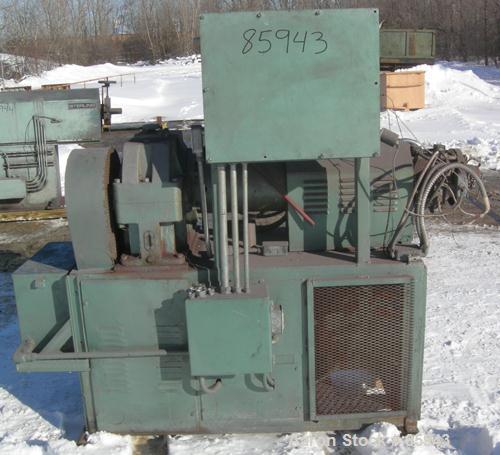 Used Munchy 4" Tapered to 2" Single Screw Extruder, Approximate 8:1 L/D Ratio. Electrically heated, air cooled, non-vented barrel. Feed throat with ram feeder driven by an 11 KW (15 HP) motor thru a ...