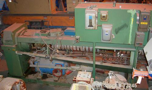 USED: NRM 4-1/2" single screw extruder, model PM70. 24:1 L/D ratio. Approx 6 zone top vented barrel, electrically heated, water cooled, with pump and tank. Water cooled feed throat. Approximate 42" c...
