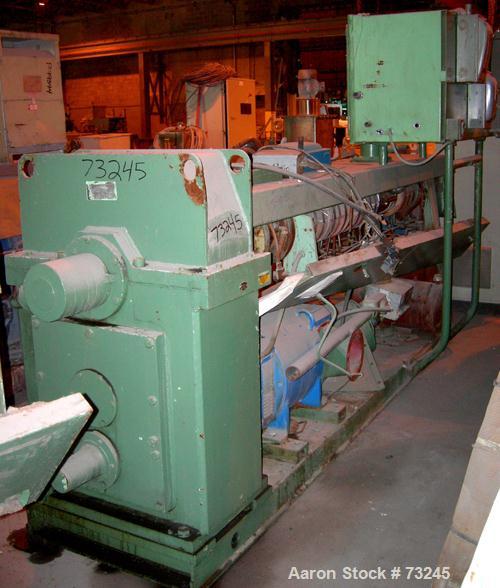 USED: NRM 4-1/2" single screw extruder, model PM70. 24:1 L/D ratio. Approx 6 zone top vented barrel, electrically heated, water cooled, with pump and tank. Water cooled feed throat. Approximate 42" c...