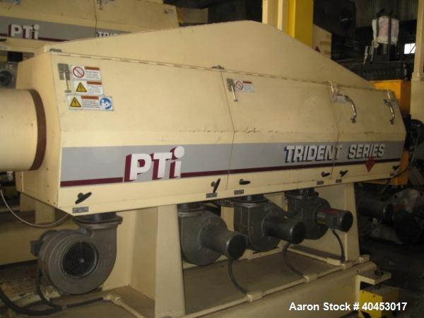 Used PTI model 5000 Trident series 5", 28:1 extruder having a 5-zone electrically heated, air cooled barrel at approximately a 55" centerline height. Gearbox is a Flenders type SZNF-320, has a reduct...