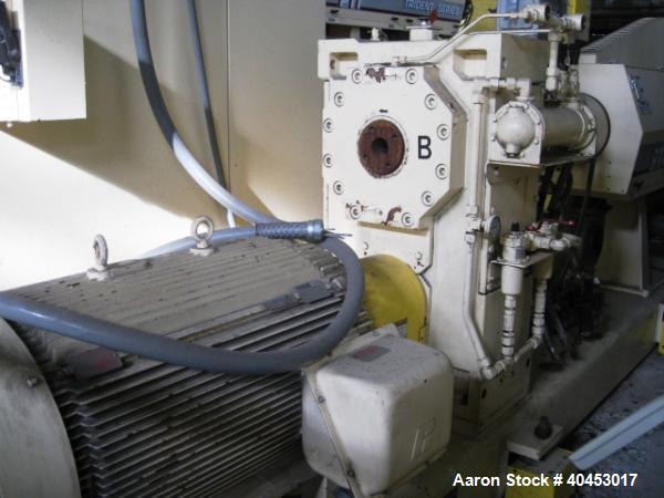 Used PTI model 5000 Trident series 5", 28:1 extruder having a 5-zone electrically heated, air cooled barrel at approximately a 55" centerline height. Gearbox is a Flenders type SZNF-320, has a reduct...