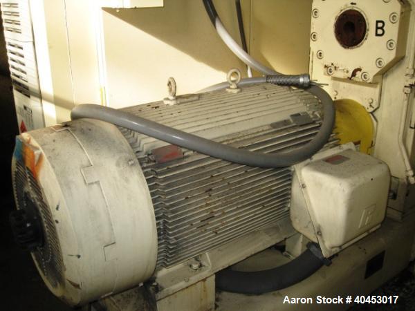 Used PTI model 5000 Trident series 5", 28:1 extruder having a 5-zone electrically heated, air cooled barrel at approximately a 55" centerline height. Gearbox is a Flenders type SZNF-320, has a reduct...