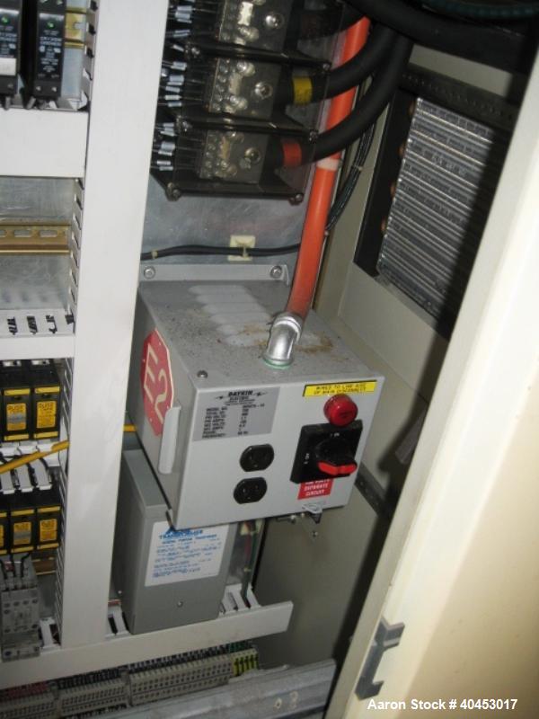 Used PTI model 5000 Trident series 5", 28:1 extruder having a 5-zone electrically heated, air cooled barrel at approximately a 55" centerline height. Gearbox is a Flenders type SZNF-320, has a reduct...