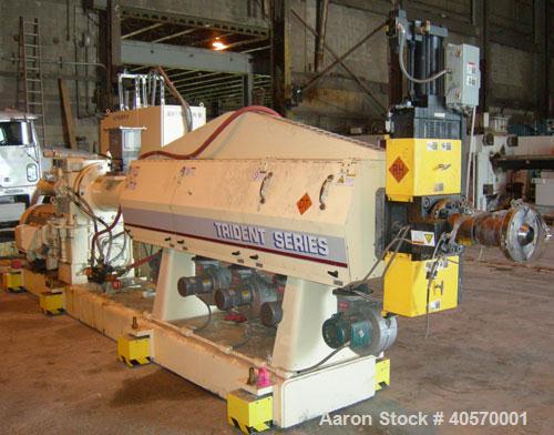 Used PTI  5" Trident Series Single Screw Extruder, Model 5000. Approximate 28 to 1 L/D ratio. 5 zone electrically heated, air cooled, non-vented barrel. Water cooled feed throat, no hopper. Approxima...
