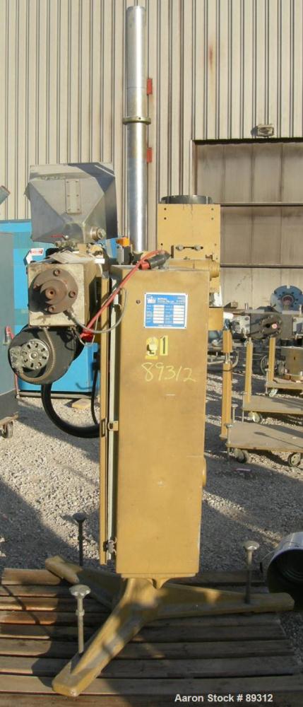Used Royal Machine 1.25" Parts Machine Pedestal Mounted Single Screw Extruder, Model 253. Approximate 24:1 L/D ratio, electrically heated, air cooled 3 zone non-vented barrel. Water cooled feed throa...