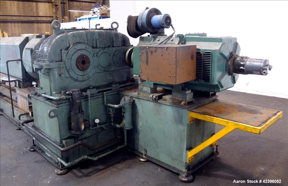 Used Sterling 6" extruder, 32:1 L/D, electrically heated, water cooled barrel with circulation system, jacketed feed section, 51" center line height, 400 hp dc motor with scr controller, 17.212:1 gea...