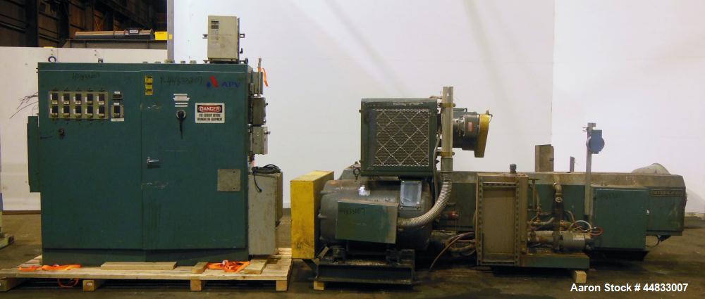 Used Sterling Extruder Corp. 3-1/2" Single Screw Lowboy Extruder. Approximately 30 to 1 L/D ratio. Electrically heated, water cooled 5 zone non-vented barrel with a pump, tank, and heat exchanger wat...