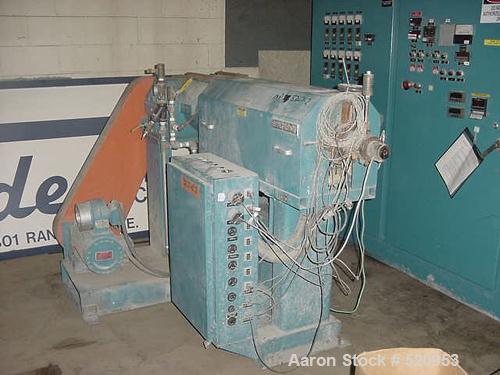 USED: 1-1/2" 30:1 Sterling extruder having a 4 zone electricallyheated, water cooled (closed loop), vented and plugged barrel atapproximately a 42" centerline height. Gearbox has a ratio of 13.93:1an...