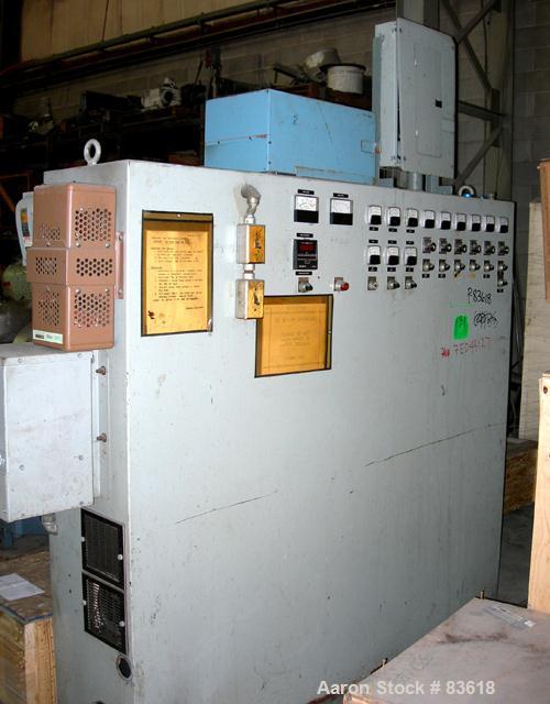 USED: Sterling pedestal mount 2" single screw extruder. Approximate30:1 L/D ratio. Electrically heated, air cooled 4 zone non-ventedbarrel. Water cooled feed throat, no hopper. Driven by a 20 hp,500 ...