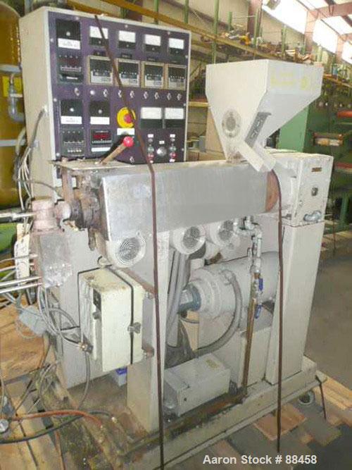 Used Wayne 1" Single Screw Extruder. Approximately 24:1 L/D ratio. Electrically heated, air cooled, non-vented barrel. Feed throat with hopper. Driven by a 5 hp DC motor. Unit includes a control pane...