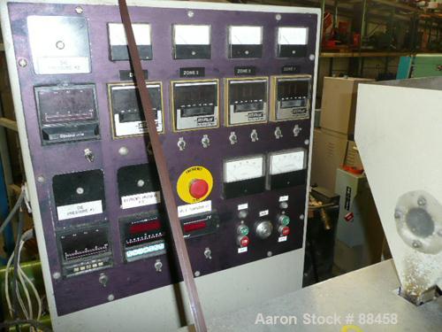 Used Wayne 1" Single Screw Extruder. Approximately 24:1 L/D ratio. Electrically heated, air cooled, non-vented barrel. Feed throat with hopper. Driven by a 5 hp DC motor. Unit includes a control pane...