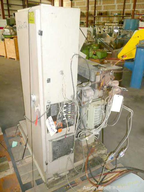 Used Wayne 1" Single Screw Extruder. Approximately 24:1 L/D ratio. Electrically heated, air cooled, non-vented barrel. Feed throat with hopper. Driven by a 5 hp DC motor. Unit includes a control pane...