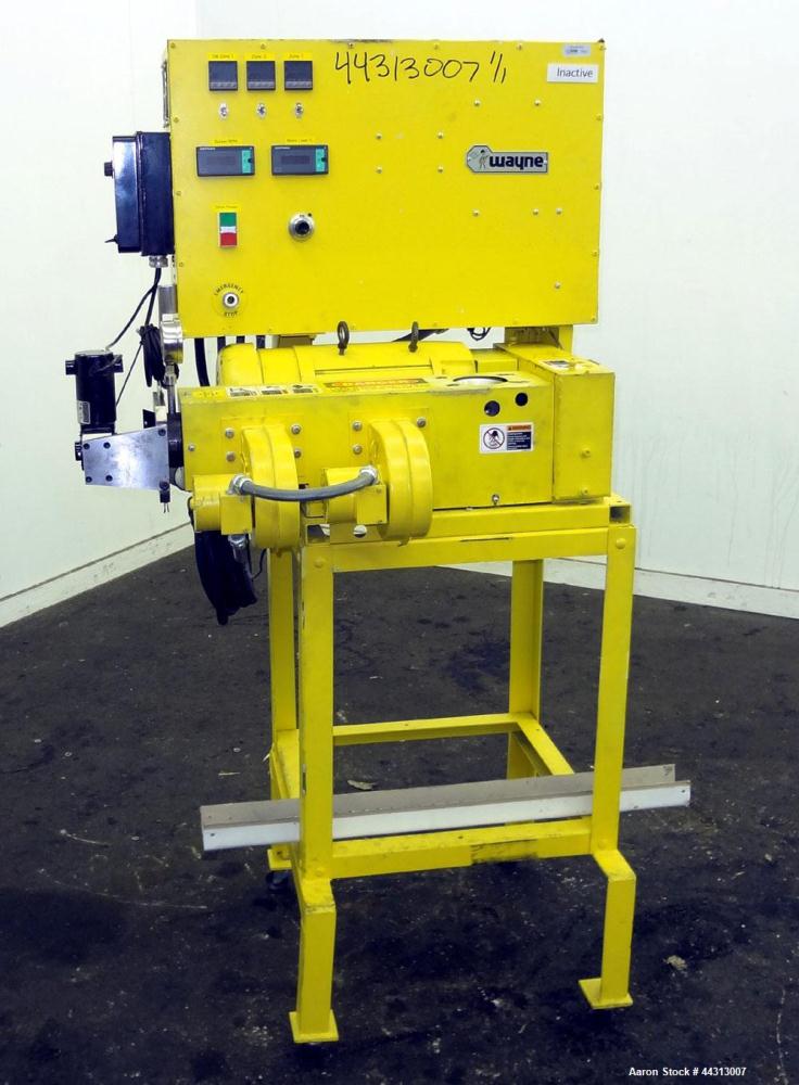 Used Wayne Machine & Die 1” Single Screw Extruder, Model Table Top. Approximately 20 to 1 L/D ratio. Electrically heated, air cooled 2 zone non-vented barrel. Water cooled feed throat, no hopper. Dri...