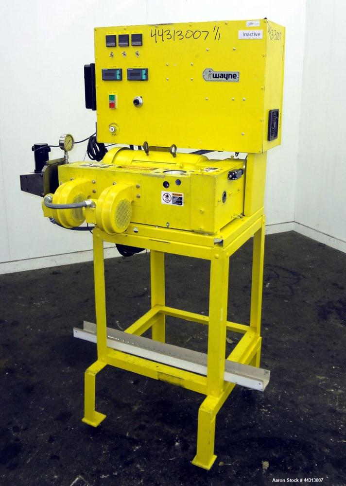 Used Wayne Machine & Die 1” Single Screw Extruder, Model Table Top. Approximately 20 to 1 L/D ratio. Electrically heated, air cooled 2 zone non-vented barrel. Water cooled feed throat, no hopper. Dri...