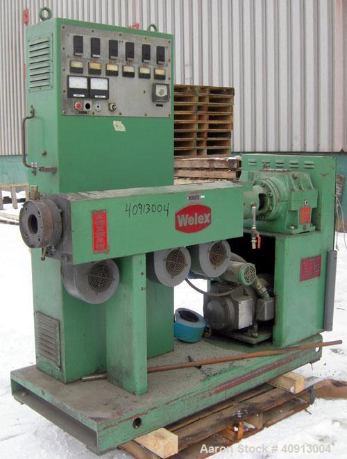 Used Welex 2" Single Screw Extruder, Model 20024:1 R.H. Approximate 24:1 L/D ratio. Electrically heated, air cooled 3 zone non-vented barrel. Water cooled feed throat, no hopper. Driven by a 20 hp, 2...