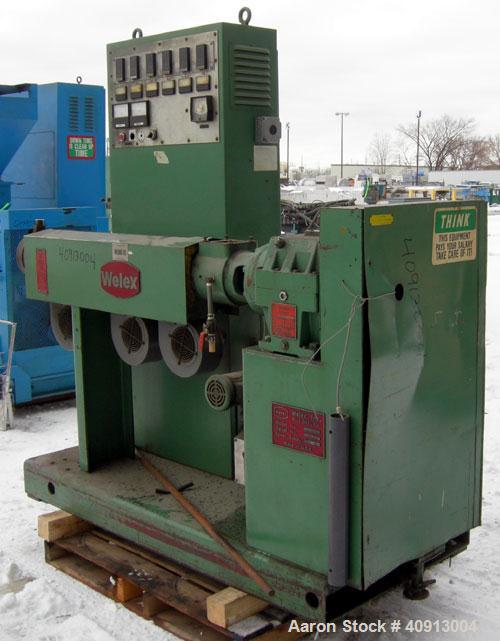 Used Welex 2" Single Screw Extruder, Model 20024:1 R.H. Approximate 24:1 L/D ratio. Electrically heated, air cooled 3 zone non-vented barrel. Water cooled feed throat, no hopper. Driven by a 20 hp, 2...