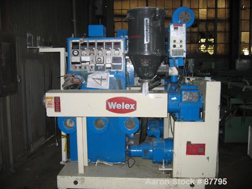Used Welex 2" Single Screw Extruder, Model 5785. Approximate 24:1 L/D ratio, electrically heated, air cooled 4 zone barrel. Feed throat with a model THD-50 hopper dryer. Extruder driven by a 20 hp DC...