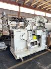 Used 100mm Buss kneader with 9/1 L/D barrel. Driven by 200 hp DC motor, includes 5.94/1 gearbox, jacketed barrel and clam shell barrel opening. Includes operator control panel. Kneader will discharge...