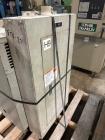Used 100mm Buss kneader with 9/1 L/D barrel. Driven by 200 hp DC motor, includes 5.94/1 gearbox, jacketed barrel and clam shell barrel opening. Includes operator control panel. Kneader will discharge...