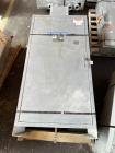 Used 100mm Buss kneader with 9/1 L/D barrel. Driven by 200 hp DC motor, includes 5.94/1 gearbox, jacketed barrel and clam shell barrel opening. Includes operator control panel. Kneader will discharge...