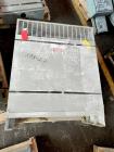Used 100mm Buss kneader with 9/1 L/D barrel. Driven by 200 hp DC motor, includes 5.94/1 gearbox, jacketed barrel and clam shell barrel opening. Includes operator control panel. Kneader will discharge...