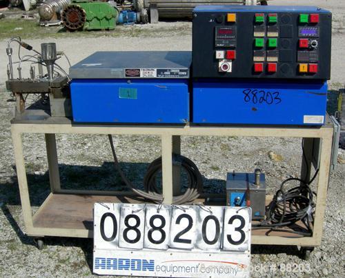 USED: APV 15MM lab size twin screw extruder, model MP2015. Co-rotating screw design. Electrically heated, water cooled barrel. Feed hopper with an accurate feeder. Driven by a 3/4 hp, 90 volt, 1725 r...