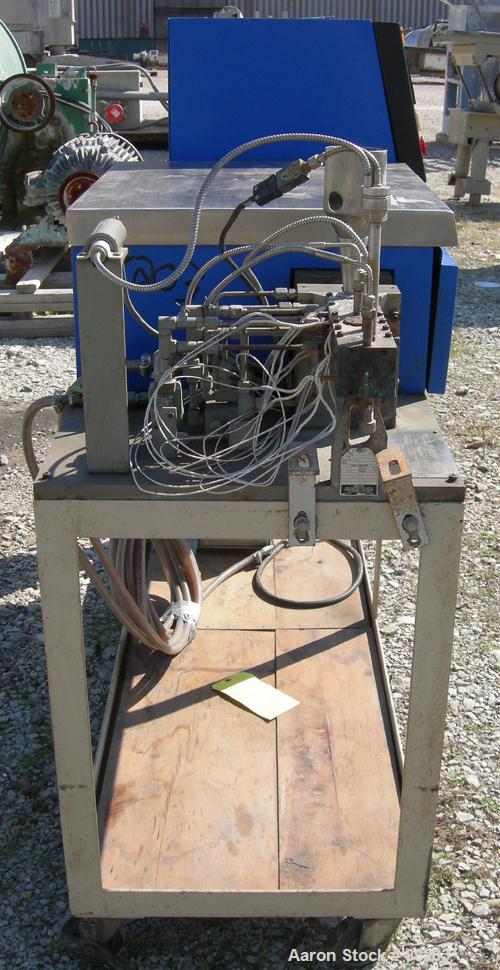 USED: APV 15MM lab size twin screw extruder, model MP2015. Co-rotating screw design. Electrically heated, water cooled barrel. Feed hopper with an accurate feeder. Driven by a 3/4 hp, 90 volt, 1725 r...