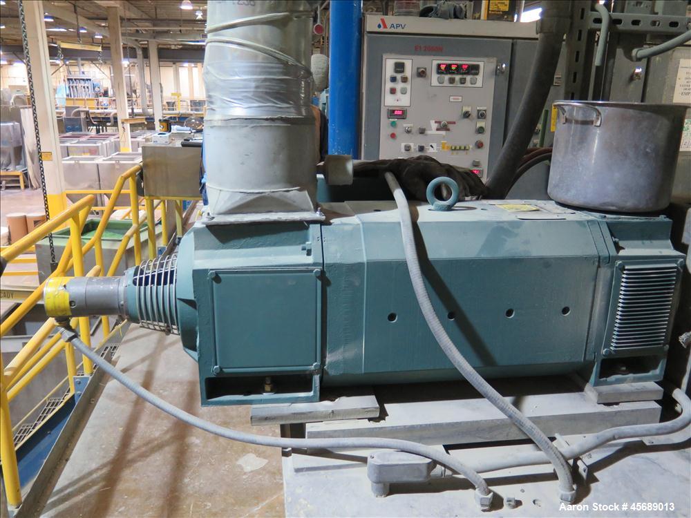Used APV Baker Perkins 80mm Twin Screw Extruder, Model MP 2080.  DC Motor 150HP.  New PIV gearbox.  Includes; Schenck Accurate 902M Series Feeder, Steel Belt Systems Cooling Belt, Controls and Drive ...