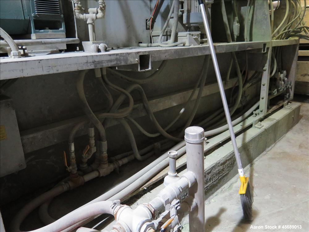 Used APV Baker Perkins 80mm Twin Screw Extruder, Model MP 2080.  DC Motor 150HP.  New PIV gearbox.  Includes; Schenck Accurate 902M Series Feeder, Steel Belt Systems Cooling Belt, Controls and Drive ...